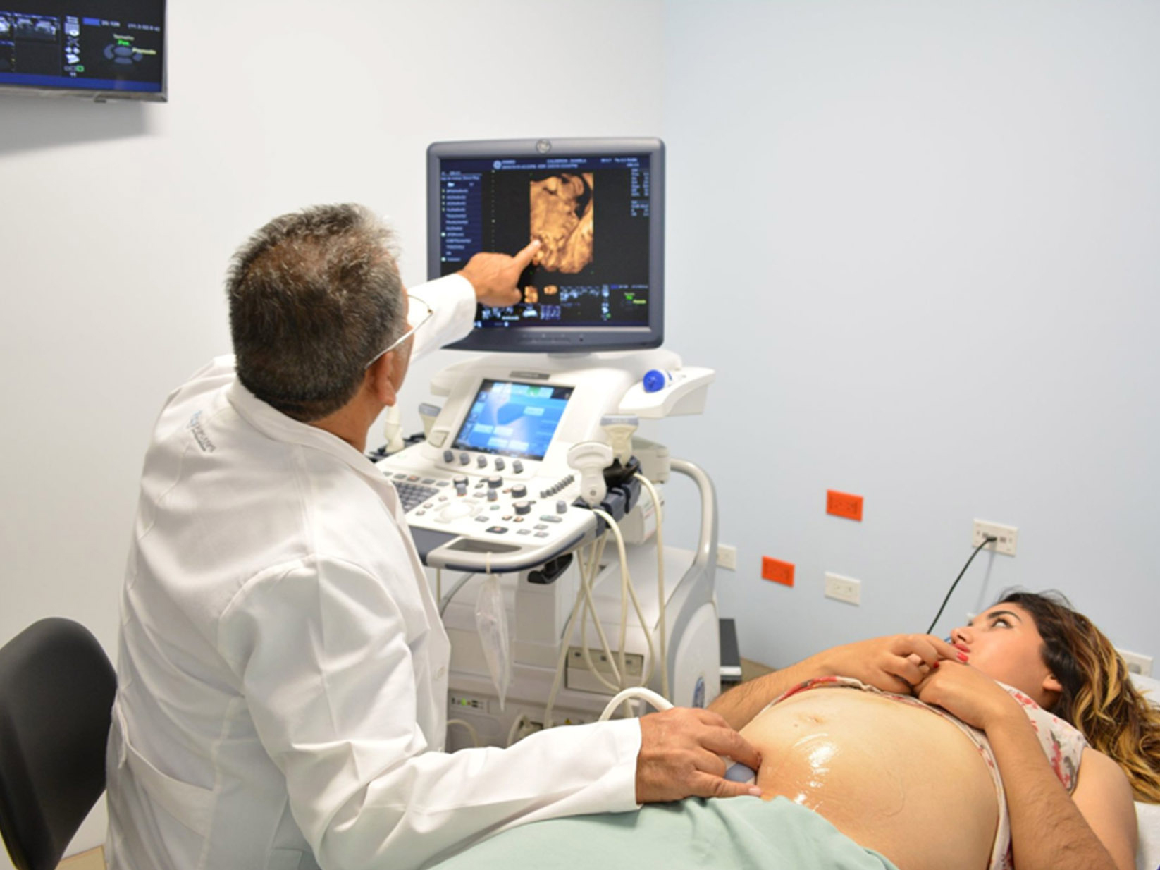 Doctor performs a fetal ultrasound on a patient at the OSME clinic.