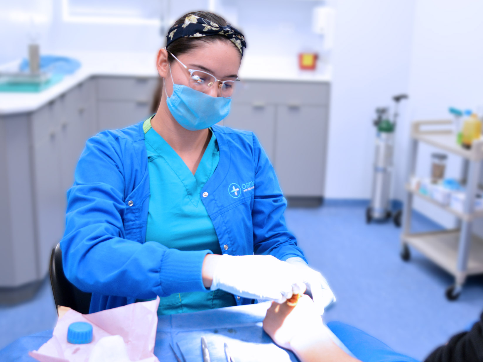 Nurse dressing a patient wound at OSME clinic