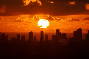 Sunrise coming up over the buildings of the Gold Coast.