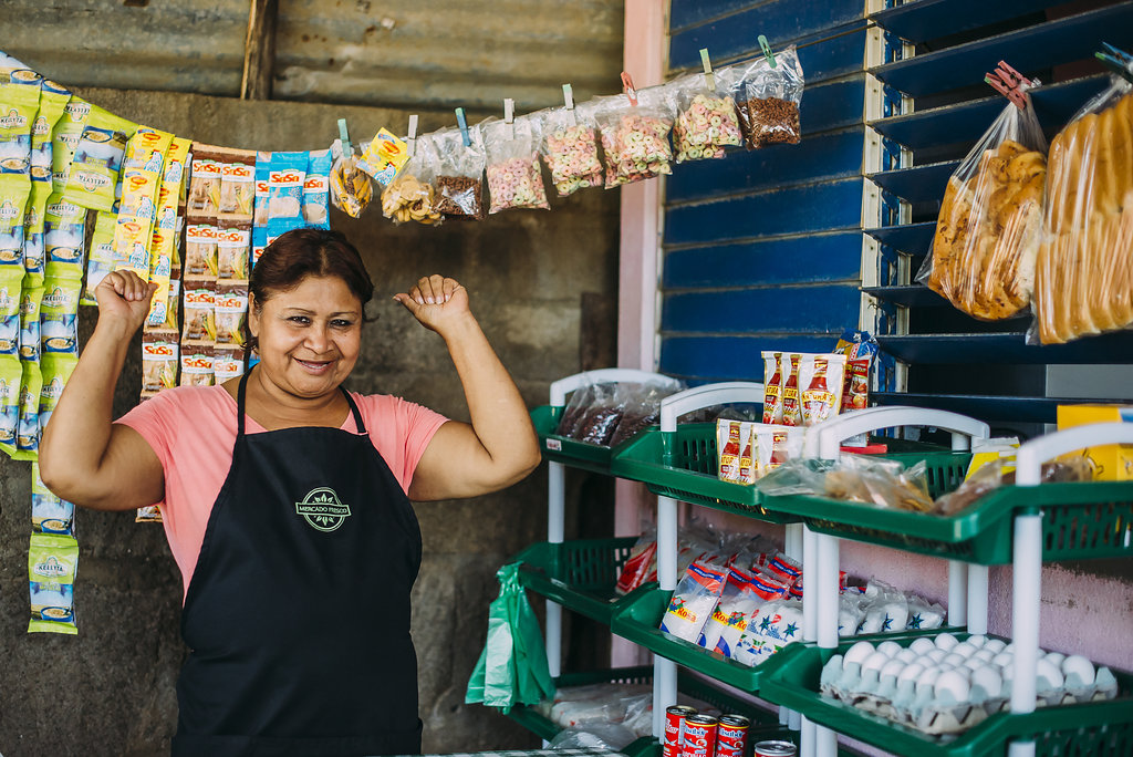 Woman smiling in the middle of her store